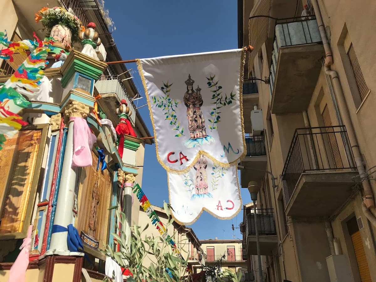 Detail of the painted flags on a historic cilio in Racalmuto